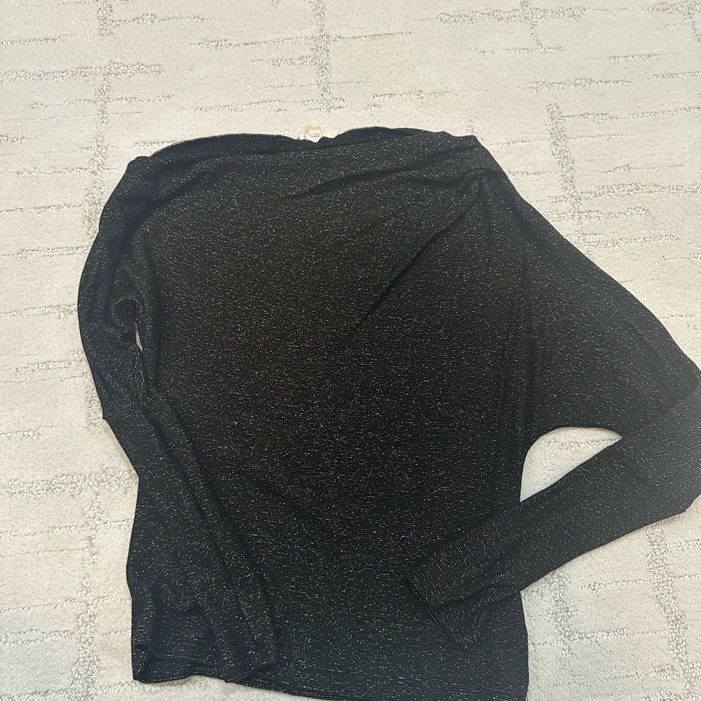 Elan gold shimmer top with a slanted off the shoulder neckline.